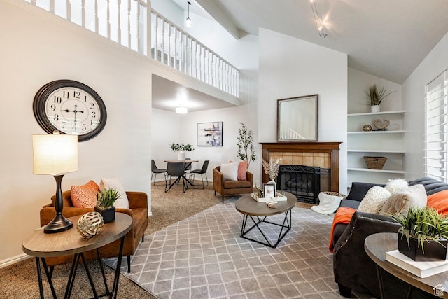 1241 N 575 W, Centerville, UT 84014 - carpeted living area featuring a fireplace, high vaulted ceiling, and built in features