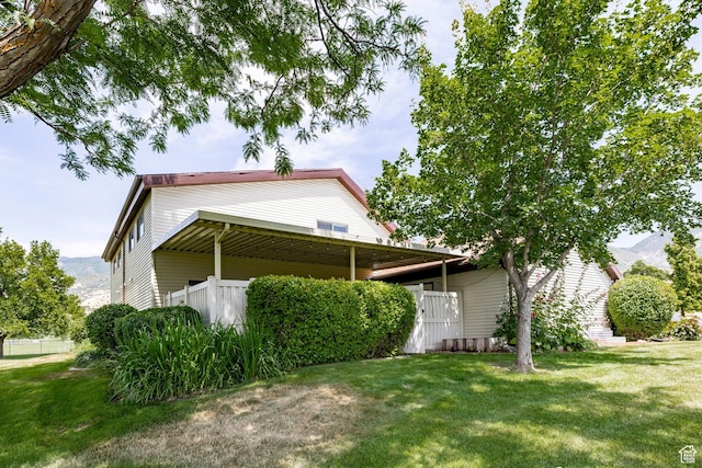 1241 N 575 W, Centerville, UT 84014 - view of property exterior featuring a lawn and a mountain view