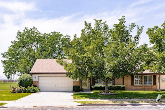 1241 N 575 W, Centerville, UT 84014 - view of front of property with brick siding, a garage, a front lawn, and driveway
