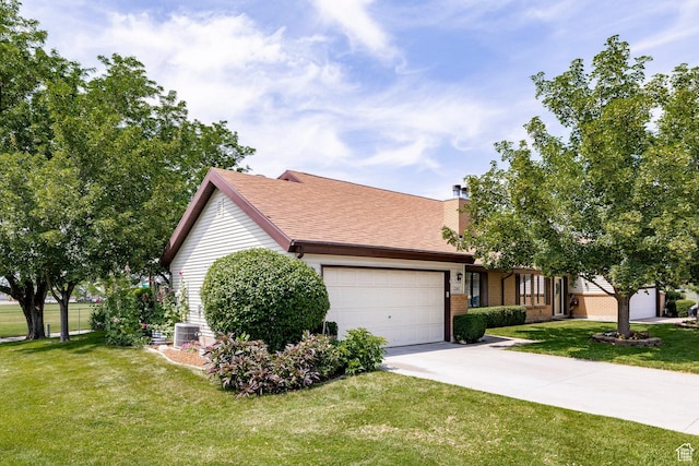 1241 N 575 W, Centerville, UT 84014 - view of front of home with an attached garage, driveway, a front yard, a chimney, and brick siding