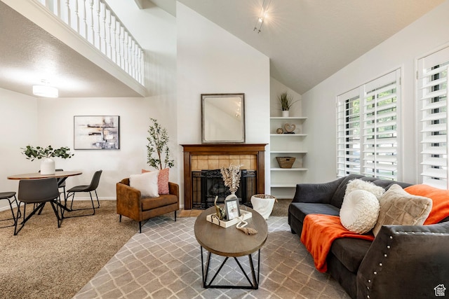 1241 N 575 W, Centerville, UT 84014 - carpeted living room with high vaulted ceiling and a tile fireplace