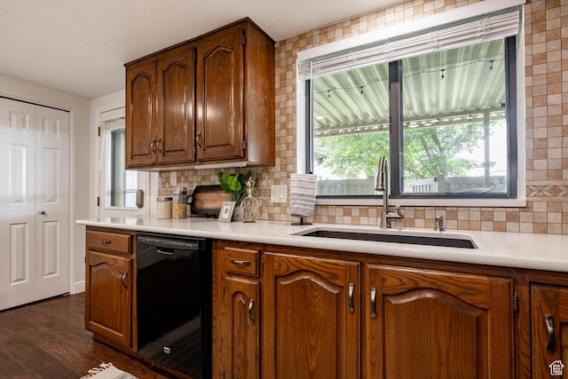 1241 N 575 W, Centerville, UT 84014 - kitchen with black dishwasher, decorative backsplash, dark wood-type flooring, and light countertops