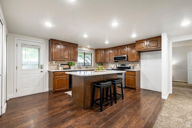 1241 N 575 W, Centerville, UT 84014 - kitchen with stainless steel appliances, dark wood-style flooring, light countertops, backsplash, and recessed lighting
