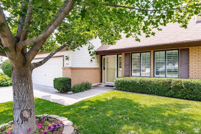 1241 N 575 W, Centerville, UT 84014 - view of front facade with brick siding, a front lawn, and a garage