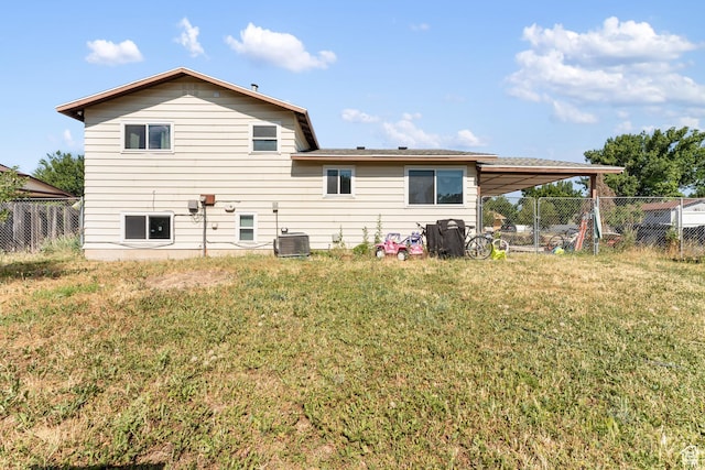 2601 N 720 W, Clinton, UT 84015 - back of house with a fenced backyard and a carport