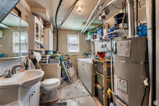 2601 N 720 W, Clinton, UT 84015 - bathroom featuring strapped water heater, independent washer and dryer, vanity, and unfinished concrete floors