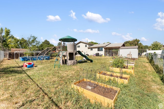2601 N 720 W, Clinton, UT 84015 - view of jungle gym with a vegetable garden