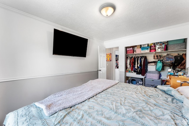 2601 N 720 W, Clinton, UT 84015 - bedroom featuring ornamental molding, a closet, and a textured ceiling