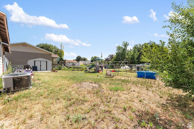 2601 N 720 W, Clinton, UT 84015 - view of yard featuring a shed and a playground