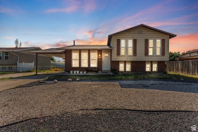 2601 N 720 W, Clinton, UT 84015 - split level home featuring brick siding, driveway, and an attached carport