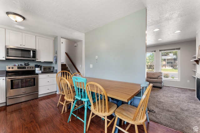 2601 N 720 W, Clinton, UT 84015 - dining area featuring a textured ceiling, recessed lighting, a fireplace, and dark wood-style floors
