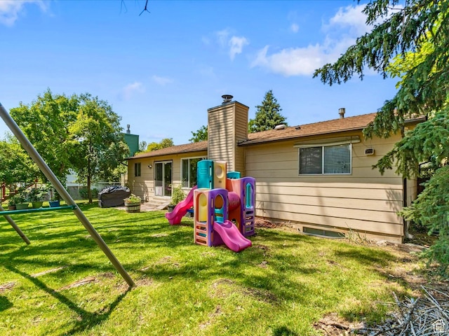 850 W 370 S, Logan, UT 84321 - rear view of property featuring a playground, a yard, and a chimney