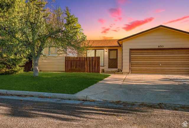 850 W 370 S, Logan, UT 84321 - view of front facade with an attached garage, a front lawn, and concrete driveway