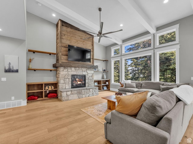 485 Parkview Dr, Summit Park, UT 84098 - living room with a ceiling fan, high vaulted ceiling, beamed ceiling, wood finished floors, and a stone fireplace