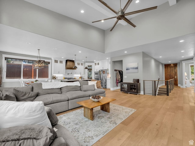 485 Parkview Dr, Summit Park, UT 84098 - living room with light wood-type flooring, recessed lighting, ceiling fan, healthy amount of natural light, and a towering ceiling
