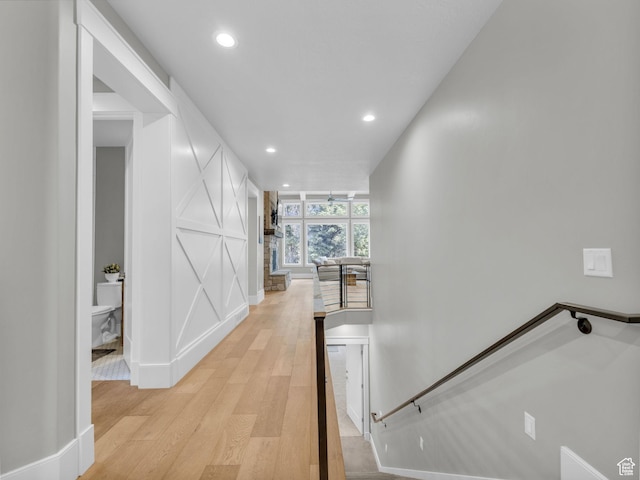 485 Parkview Dr, Summit Park, UT 84098 - hallway featuring an upstairs landing, light wood finished floors, recessed lighting, and a decorative wall