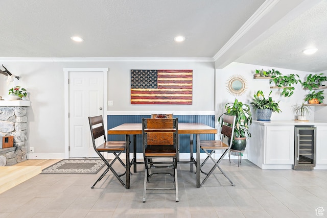 520 990 N, Pleasant Grove, UT 84062 - dining space with beverage cooler, a textured ceiling, ornamental molding, and recessed lighting