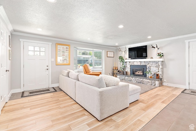 520 990 N, Pleasant Grove, UT 84062 - living room with crown molding, recessed lighting, light wood-style floors, a stone fireplace, and a textured ceiling