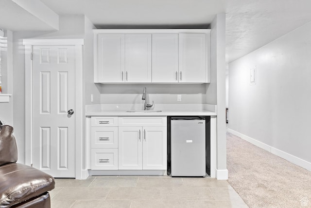 520 990 N, Pleasant Grove, UT 84062 - kitchen featuring light countertops, white cabinetry, and fridge