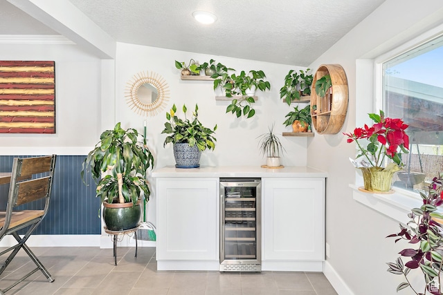 520 990 N, Pleasant Grove, UT 84062 - indoor dry bar featuring beverage cooler, light tile patterned floors, and a textured ceiling
