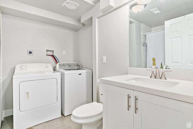 520 990 N, Pleasant Grove, UT 84062 - full bathroom featuring washing machine and clothes dryer, vanity, tile patterned flooring, and a shower with curtain
