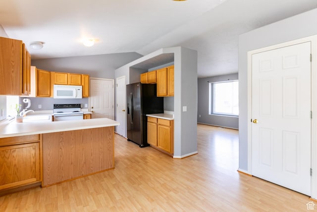 231 Amanda Lynn Ln, Midvale, UT 84047 - kitchen featuring white appliances, light wood-style flooring, light countertops, a peninsula, and vaulted ceiling