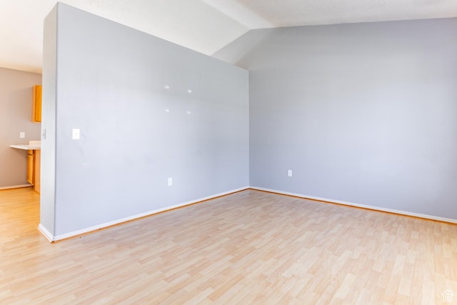 231 Amanda Lynn Ln, Midvale, UT 84047 - empty room featuring light wood-style floors and vaulted ceiling