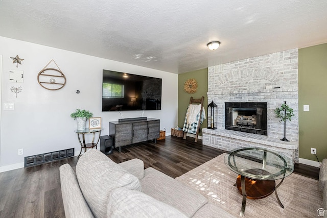 4922 S 2925 W, Roy, UT 84067 - living room with wood finished floors, a fireplace, and a textured ceiling