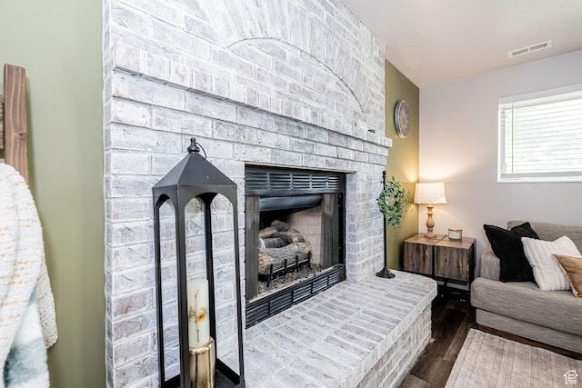 4922 S 2925 W, Roy, UT 84067 - living area with dark wood-type flooring and a brick fireplace