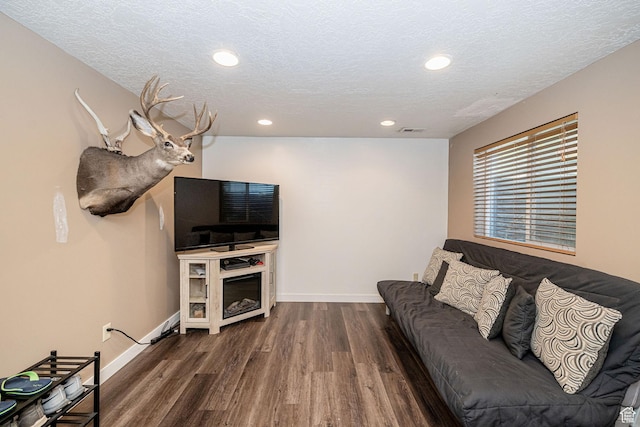 4922 S 2925 W, Roy, UT 84067 - living area featuring dark wood-style flooring, a textured ceiling, and recessed lighting
