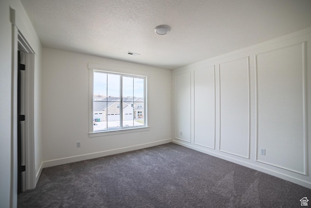 7169 W Moorepark Pl, West Jordan, UT 84081 - empty room with dark carpet and baseboards