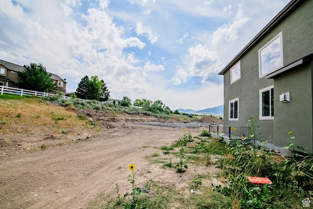 7169 W Moorepark Pl, West Jordan, UT 84081 - view of dirt / gravel road with a mountain view