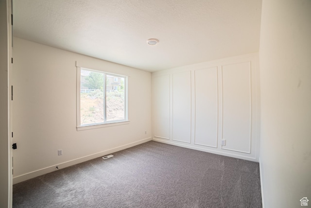 7169 W Moorepark Pl, West Jordan, UT 84081 - empty room featuring carpet floors and baseboards