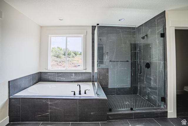 7169 W Moorepark Pl, West Jordan, UT 84081 - full bath with a garden tub, a stall shower, and tile patterned floors