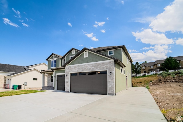 7169 W Moorepark Pl, West Jordan, UT 84081 - craftsman-style house with stone siding, concrete driveway, and a garage