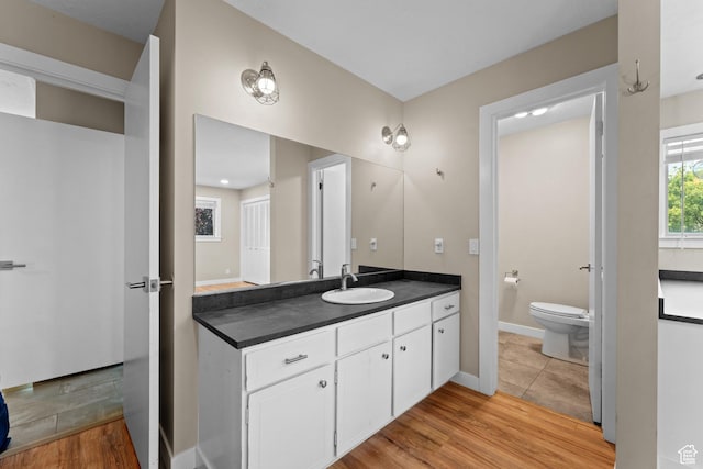 4281 S Nielsen Way, West Valley City, UT 84119 - full bathroom with vanity and wood finished floors