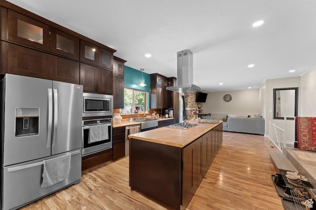 4281 S Nielsen Way, West Valley City, UT 84119 - kitchen with appliances with stainless steel finishes, dark brown cabinets, open floor plan, island exhaust hood, and light wood-type flooring