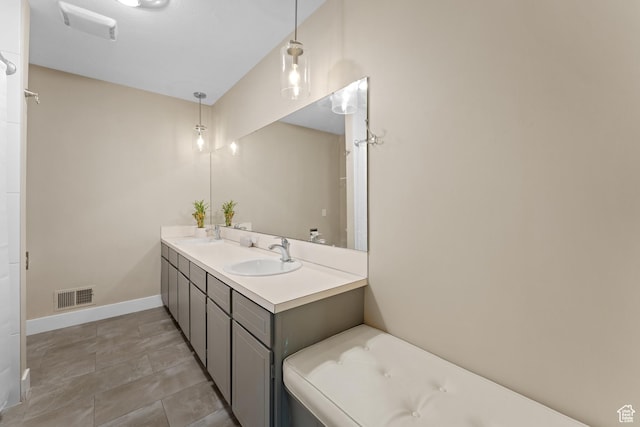 4281 S Nielsen Way, West Valley City, UT 84119 - bathroom with double vanity and baseboards