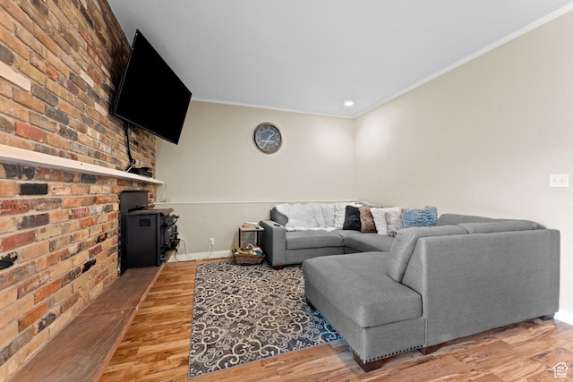 4281 S Nielsen Way, West Valley City, UT 84119 - living area featuring light wood-style floors, ornamental molding, brick wall, and recessed lighting