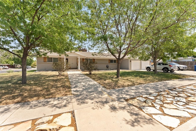 4281 S Nielsen Way, West Valley City, UT 84119 - view of front of house with concrete driveway and a front lawn
