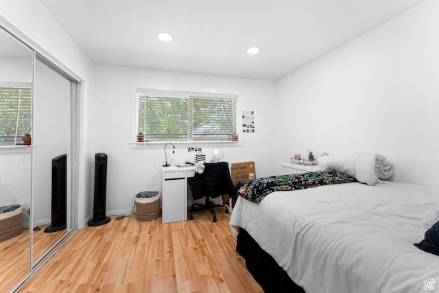 4281 S Nielsen Way, West Valley City, UT 84119 - bedroom with multiple windows, a closet, light wood-type flooring, and recessed lighting