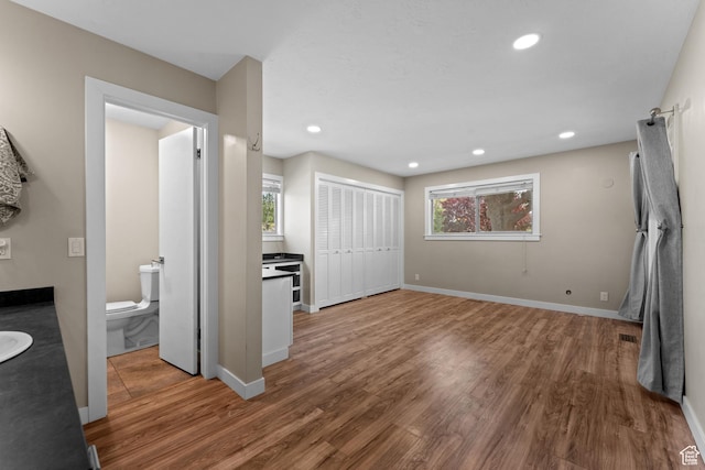 4281 S Nielsen Way, West Valley City, UT 84119 - unfurnished bedroom with wood finished floors, recessed lighting, and a closet