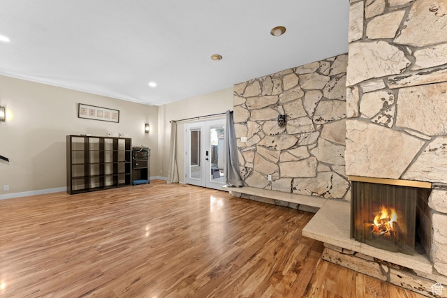4281 S Nielsen Way, West Valley City, UT 84119 - unfurnished living room featuring wood finished floors and a stone fireplace