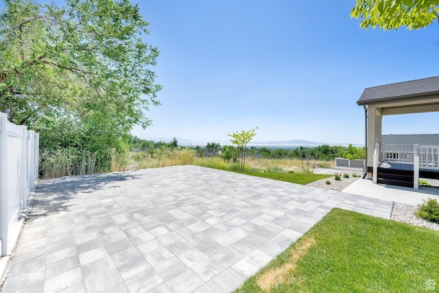 1378 E Orchard Ridge Ln, Kaysville, UT 84037 - view of patio with a deck with mountain view