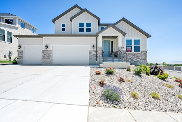 1378 E Orchard Ridge Ln, Kaysville, UT 84037 - view of front of property with board and batten siding, stone siding, a garage, and concrete driveway
