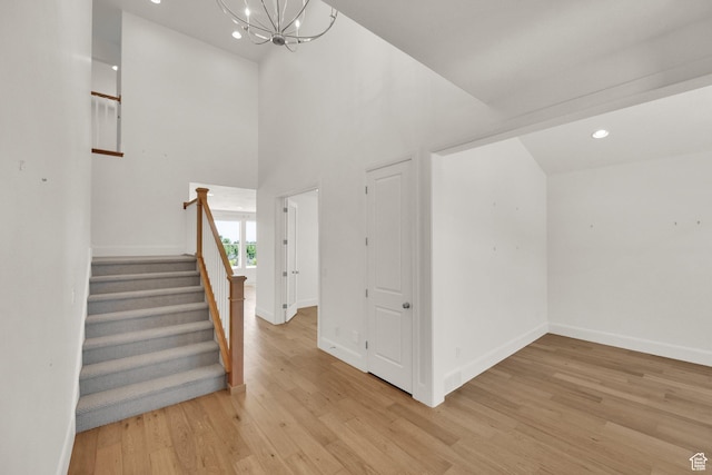 1378 E Orchard Ridge Ln, Kaysville, UT 84037 - staircase featuring a chandelier, wood finished floors, recessed lighting, and a high ceiling