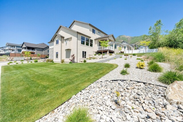 1378 E Orchard Ridge Ln, Kaysville, UT 84037 - rear view of house featuring stucco siding and a residential view