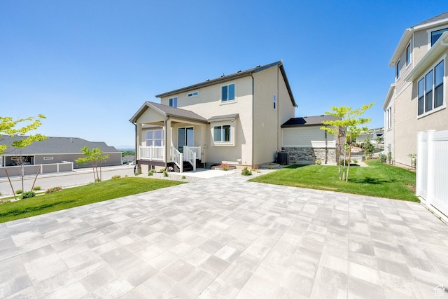 1378 E Orchard Ridge Ln, Kaysville, UT 84037 - rear view of property with a lawn, stucco siding, and a patio area