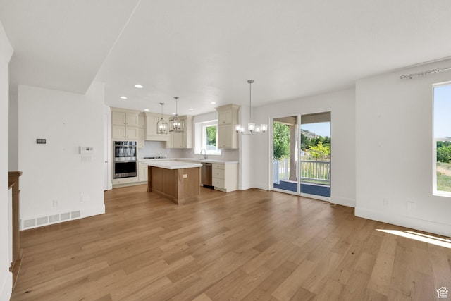 1378 E Orchard Ridge Ln, Kaysville, UT 84037 - kitchen featuring a chandelier, light wood-type flooring, light countertops, a center island, and recessed lighting