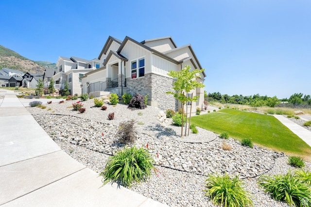 1378 E Orchard Ridge Ln, Kaysville, UT 84037 - view of property exterior with stone siding, a residential view, and a mountain view
